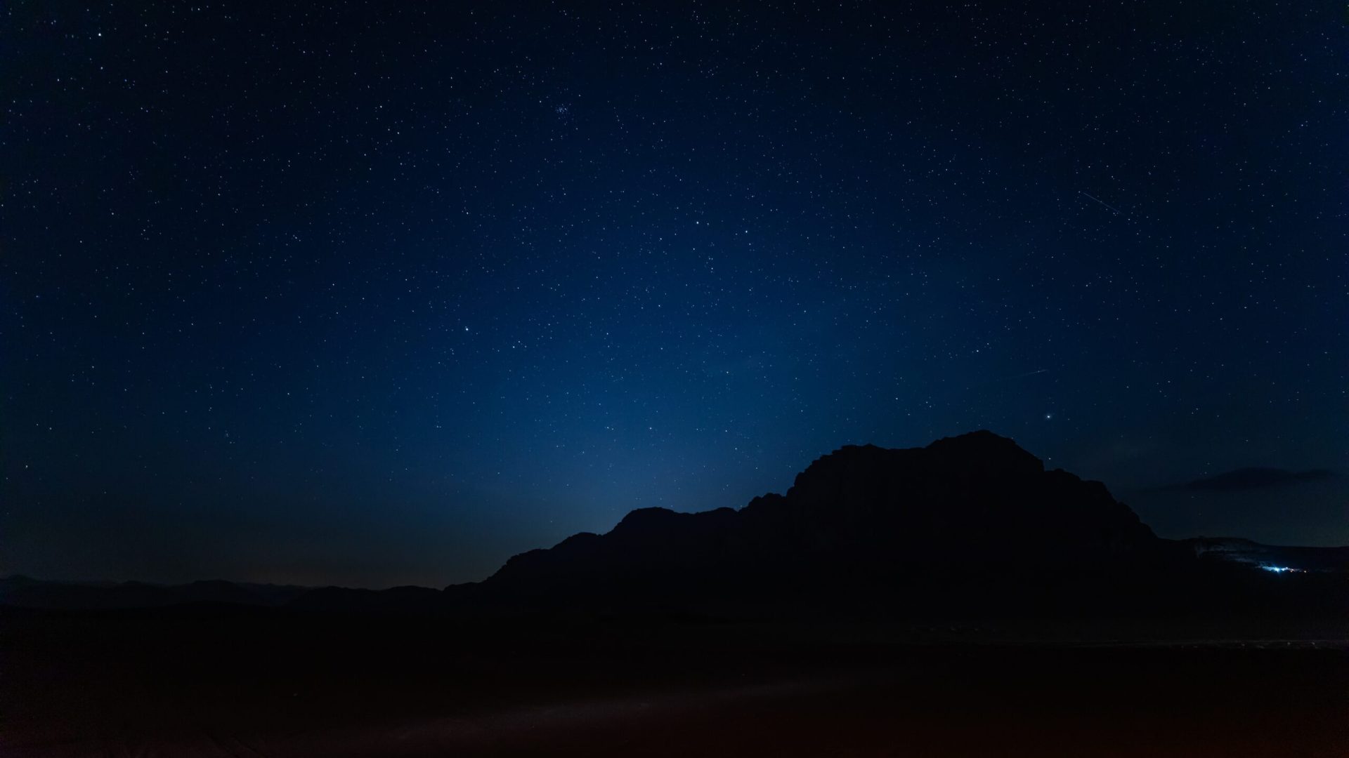 Captivating,Night,Sky,,Sprinkled,With,Stars,Sets,Over,The,Silhouette
